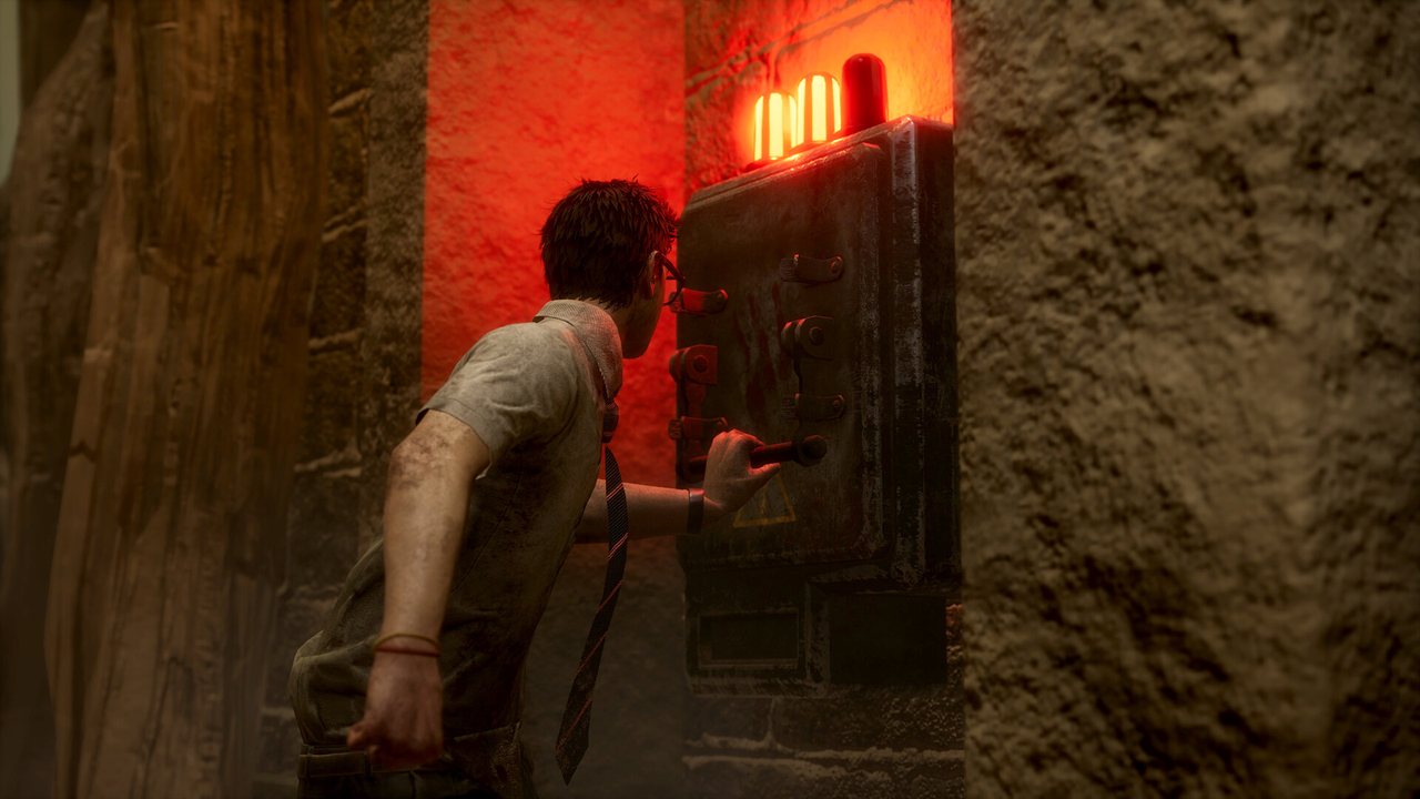 A survivor creeping along a wall in a dark corridor